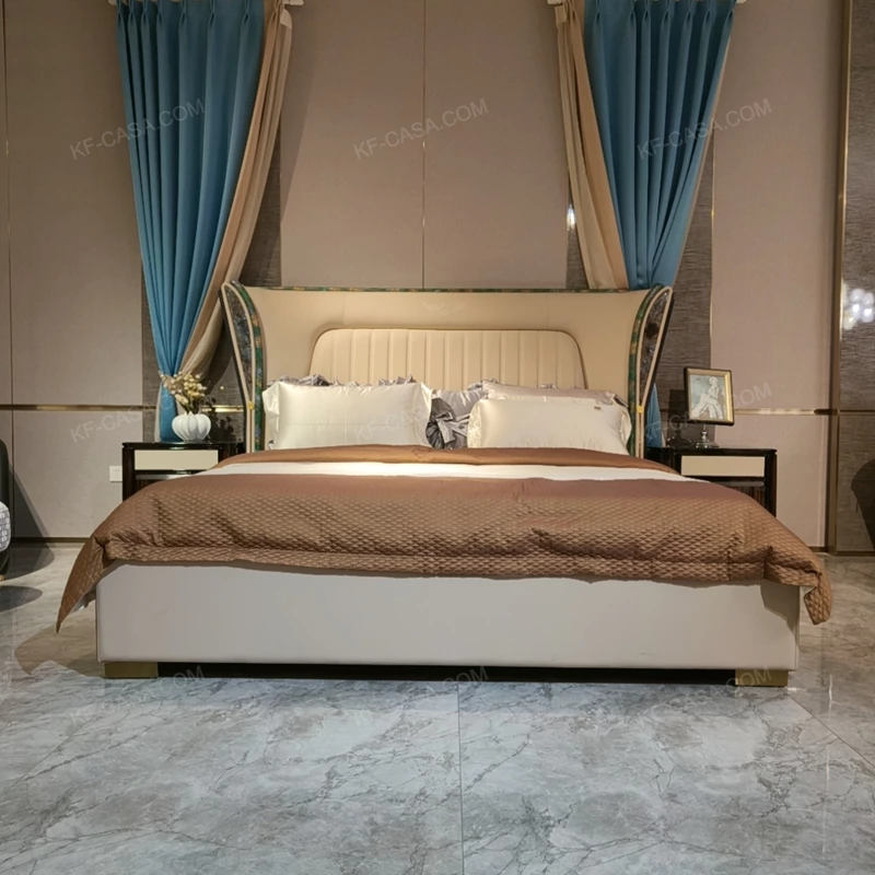 Cream Upholstered Bed with Decorative Accent Trim, Brand Emblem & Gold Stainless Steel Feet